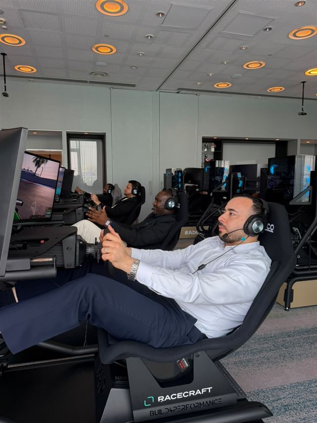 Guests racing side by side on Racecraft simulators
