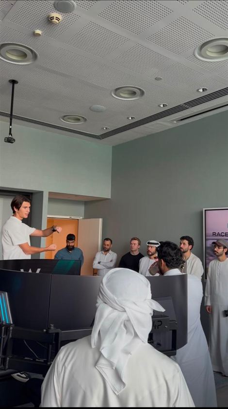 A host introducing the simulators to guests